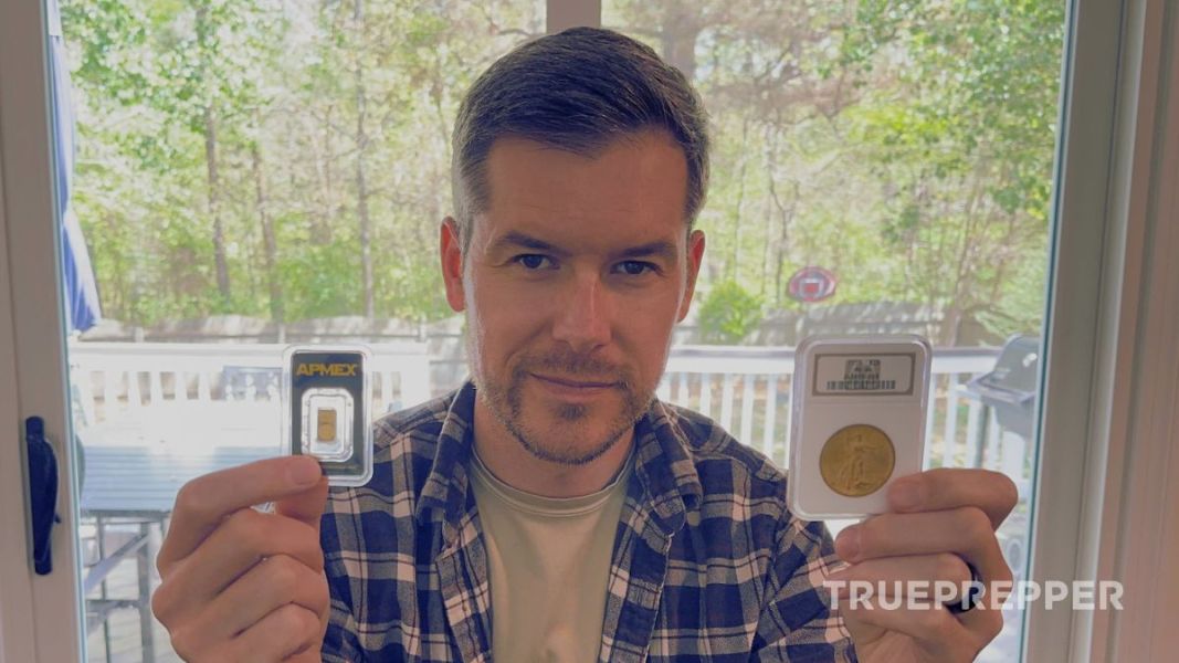 Sean holding up a small gold bar and numismatic gold coin.